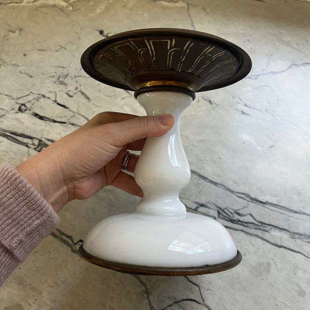 Biedermeier centerpiece from around 1830. White frosted glass, brass. H 19 cm. Baluster stem and arched brass-framed...