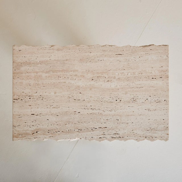 A petite 1970s Italian console table crafted entirely from warm, earthy-toned unfilled travertine. Its rough-hewn top...
