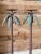 A whimsical pair of vintage metal floor candle holders designed as tall, sculptural palm trees. Each features a...