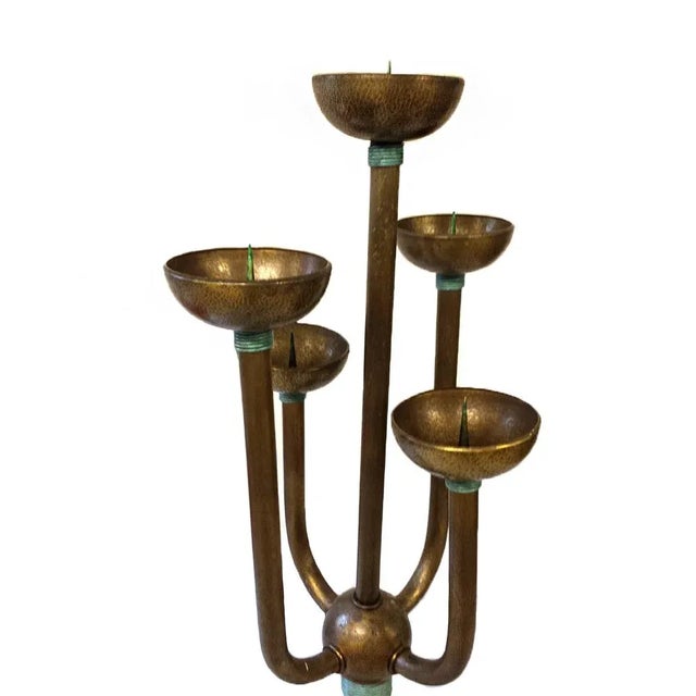This large Arts and Crafts hammered copper standing candle holder is thought to be the only one of its kind.