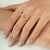 The Carat&Her Infinity Bow Promise Ring features a graceful bow-inspired design symbolizing connection and commitment....