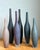 This curated set of six vintage Italian art glass vases exemplifies the minimalist elegance and architectural grace of...