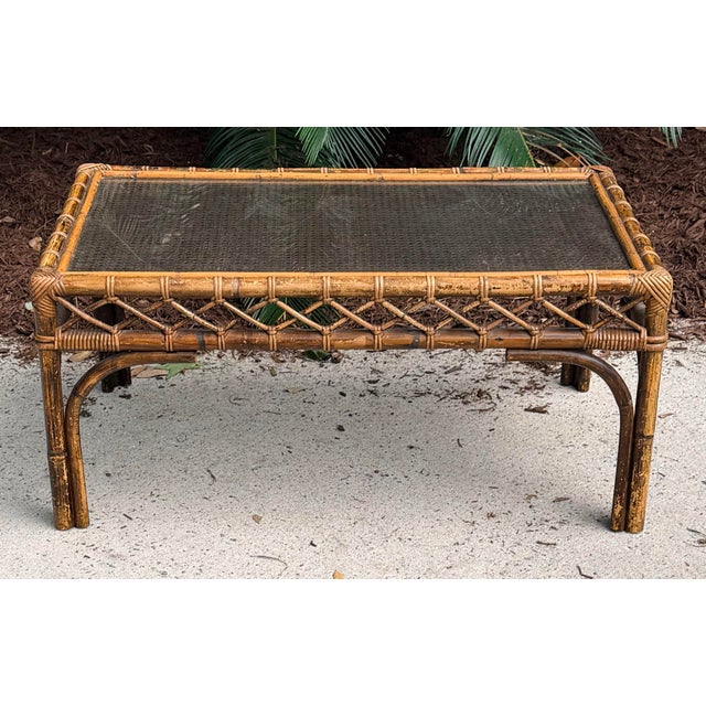 Beautiful cane, bamboo and glass Midcentury Hollywood Regency coffee table. Fantastic to blend with tortoise rattan...