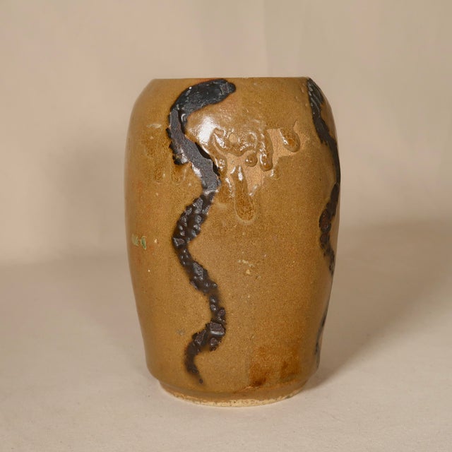 This original ceramic vessel is hand-thrown and wood-fired, resulting in a richly tactile surface shaped by flame, ash,...