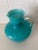 Add a splash of color to your room with this lovely hand-blown pitcher featuring a turquoise cased glass body with a clear...