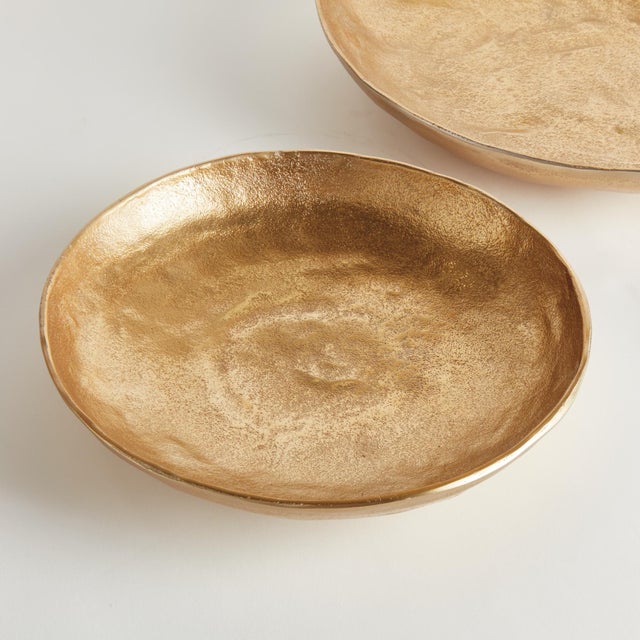 This pair of handcrafted bowls has simple round silhouettes, with a matte finish and subtle texture. They can be styled...