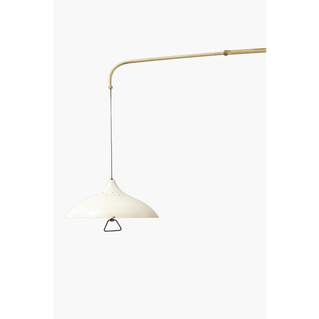 A wonderfully scaled 1950s Italian extending wall light by Lumen Milano. The arm swings on the wall bracket and extends to...