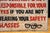 Hand-painted metal industrial safety sign with bold red and black block lettering reading, "THIS COMPANY IS NOT...