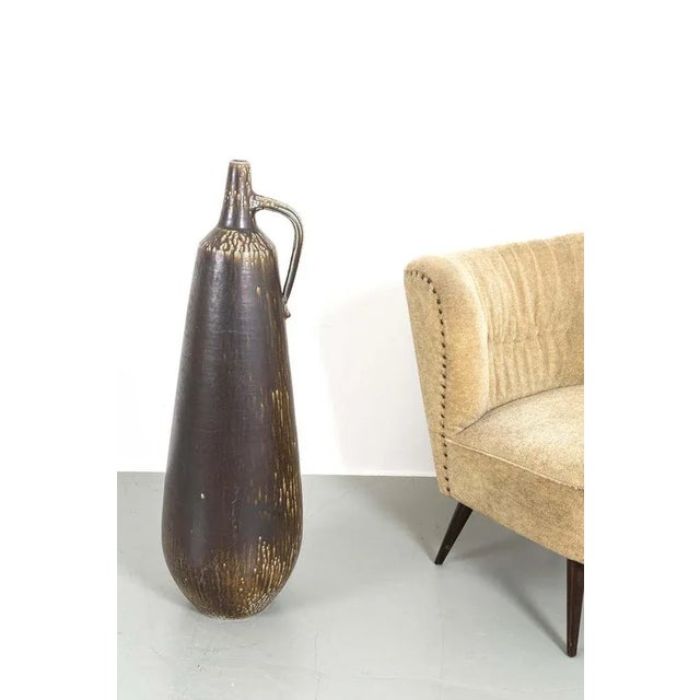 High German Ceramic Vase from the Sixties with An Exceptionally Beautiful Design. In good vintage condition. Measurements...