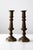 This pair of vintage brass candlestick holders offers a quiet, balanced presence, defined by turned stems and octagonal...
