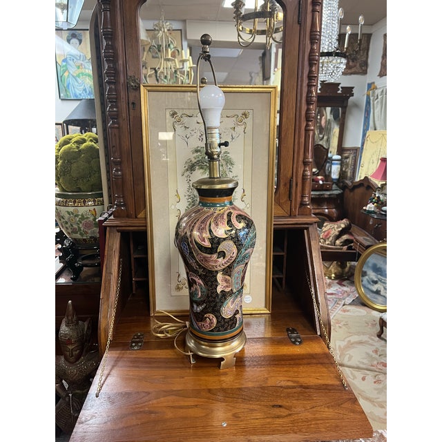 This vintage Frederick Cooper Paisley Table Lamp features a hand-painted navy/black ceramic vase body adorned with...