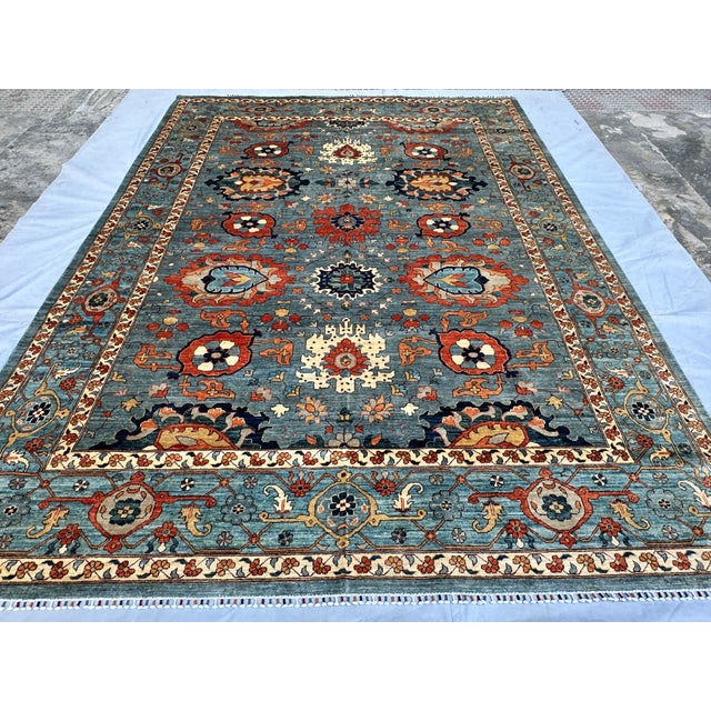 This stunning hand-knotted wool area rug features a classic Sultanabad design with an elegant Chobi styling. The large...