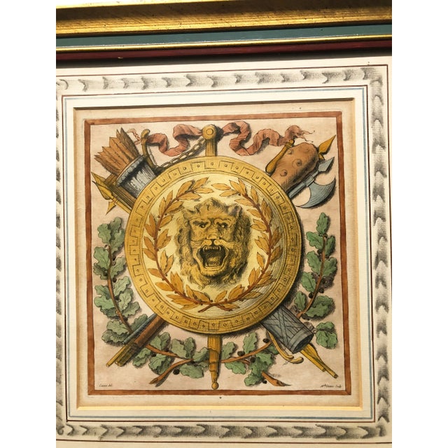 Antique Neoclassic Handcolored Print of Lion Medallion surrounded by a wreath with quills and armor. Art dated 1775,...