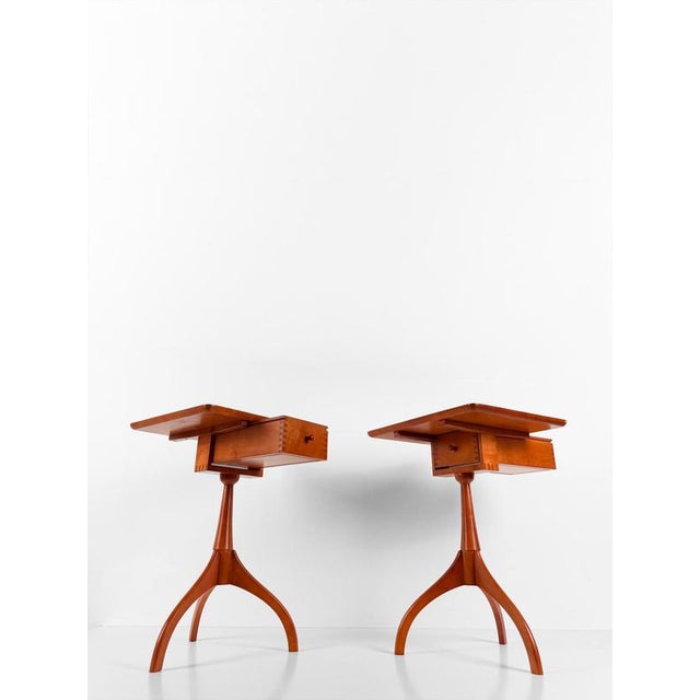 We are pleased to offer for sale a pair of side tables with drawers, whose design is inspired by the celebrated Shaker...