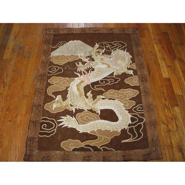 Antique Chinese Textile Small Wool & Silk Brown Dragon Embroidery Wall Hanging, Circa Date: 1890s. This exceptional late...