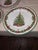Three Radko Christmas tree dinner plates.