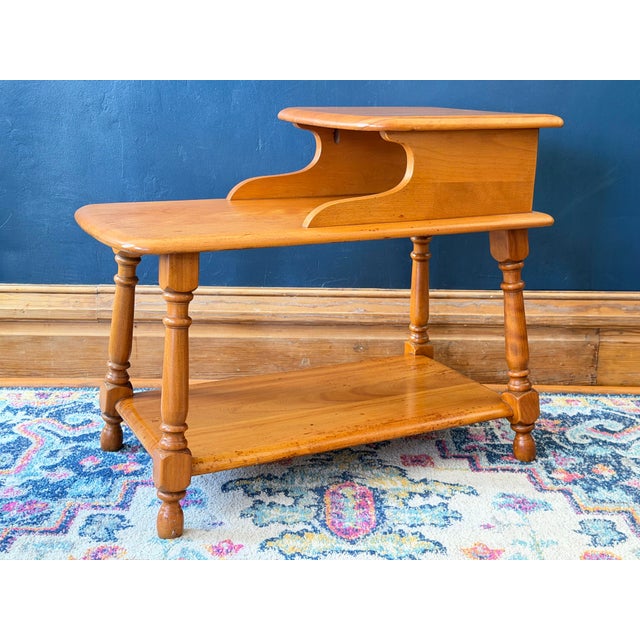 A quintessential piece of American craftsmanship, this model 607-G step table comes from Heywood-Wakefield’s "Old Colony"...
