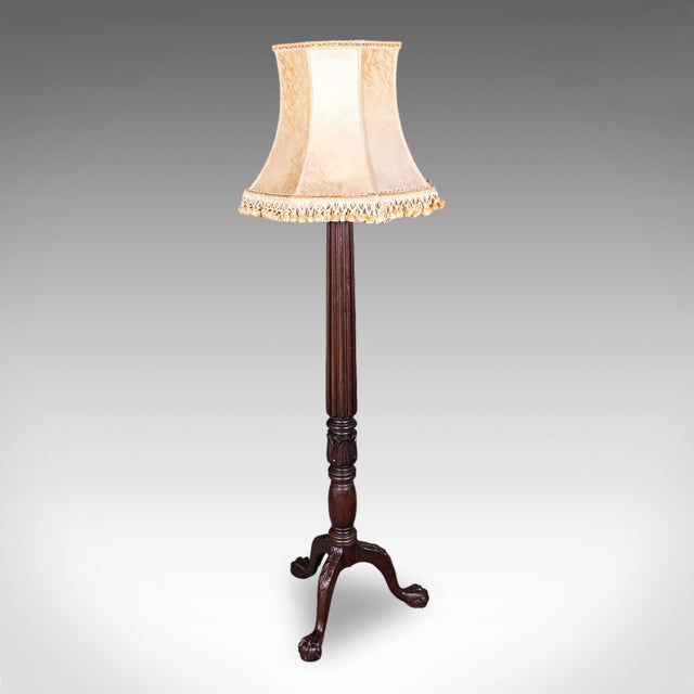 This is an antique standard lamp. An English, mahogany lounge reading light in William IV revival taste, dating to the...