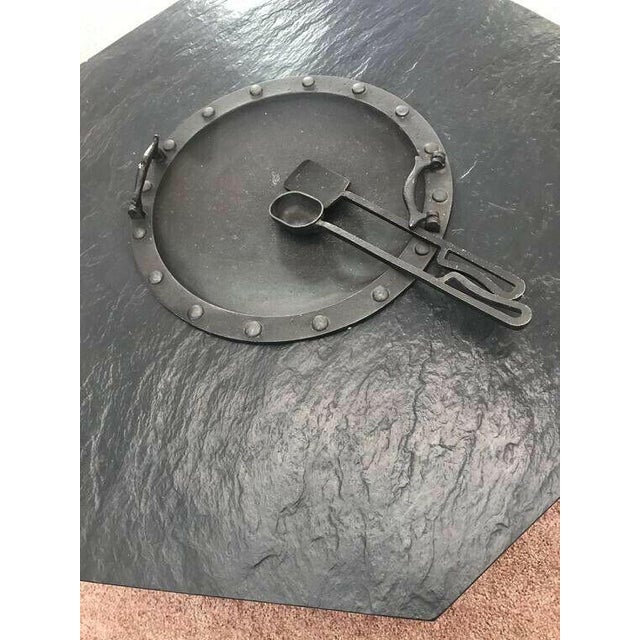 Elevate Your Space with a Vintage Mid-Century Octagonal Slate Hibachi Wrought Iron Cocktail/Coffee Table Introduce a touch...