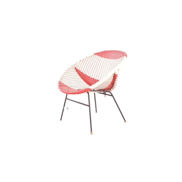 Wonderful plastic fabric chair from the mid-20th century. Tubular metal legs with rubber caps. The seat is woven with...