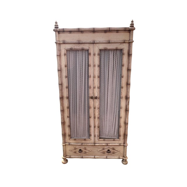 Vintage Faux Bamboo Coastal Armoire / Entertainment Cabinet Charming vintage faux bamboo armoire featuring a distressed...