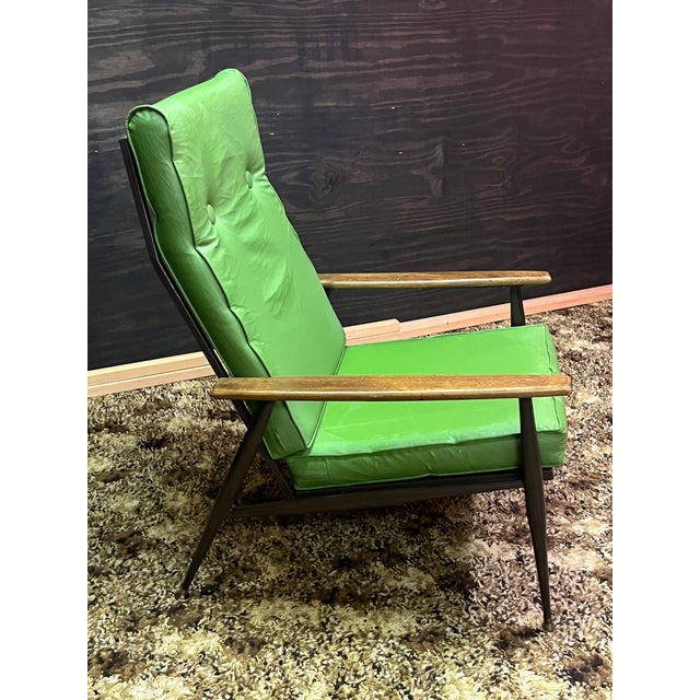 Capture the ultimate retro lounge aesthetic with this striking mid-century modern high-back lounge chair from the 1960s....