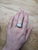 This stunning ring features a 6.8-carat Ethiopian opal with a mesmerizing play of colors. It's surrounded by a sparkling...