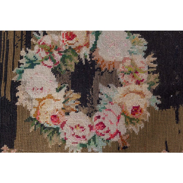 This exquisite 19th-century European needlepoint rug is a striking celebration of floral elegance and craftsmanship. Woven...