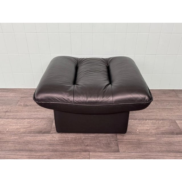Large pouf made in Italy in the 1980s. Made of black leather. Very soft and comfortable, even for sitting.