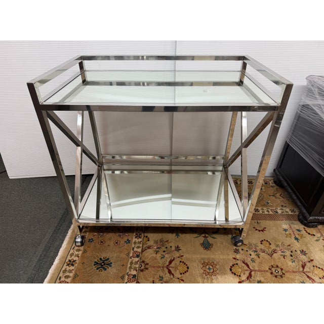 Design Plus Gallery presents the Stainless Steel Gerard Bar Cart from Worlds Away. X marks the spot for unforgettable...