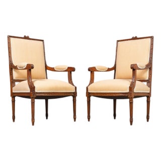 Pair of French Louis XVI Carved Walnut Fauteuil Armchairs For Sale