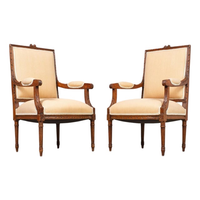 Pair of French Louis XVI Carved Walnut Fauteuil Armchairs For Sale