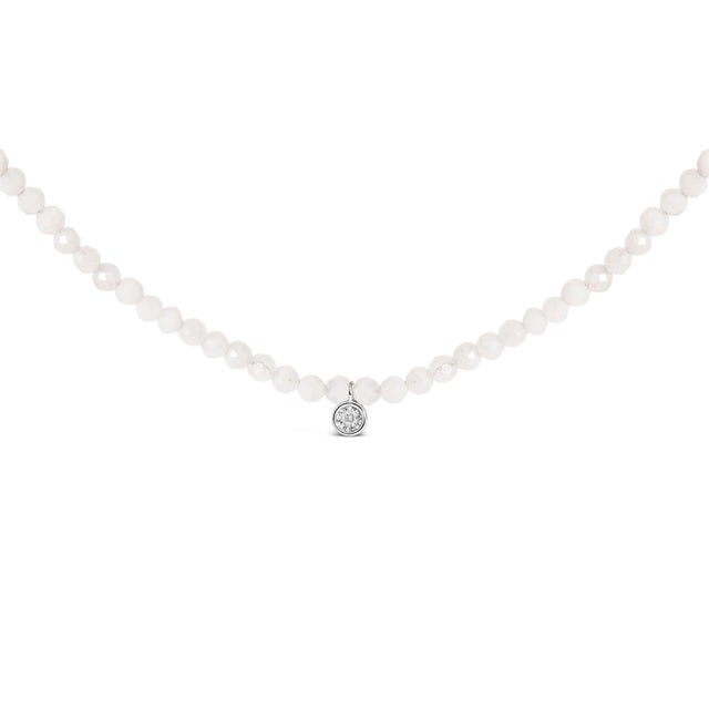 Gracefully designed, this exquisite necklace combines the celestial glow of natural white moonstone beads with the subtle...