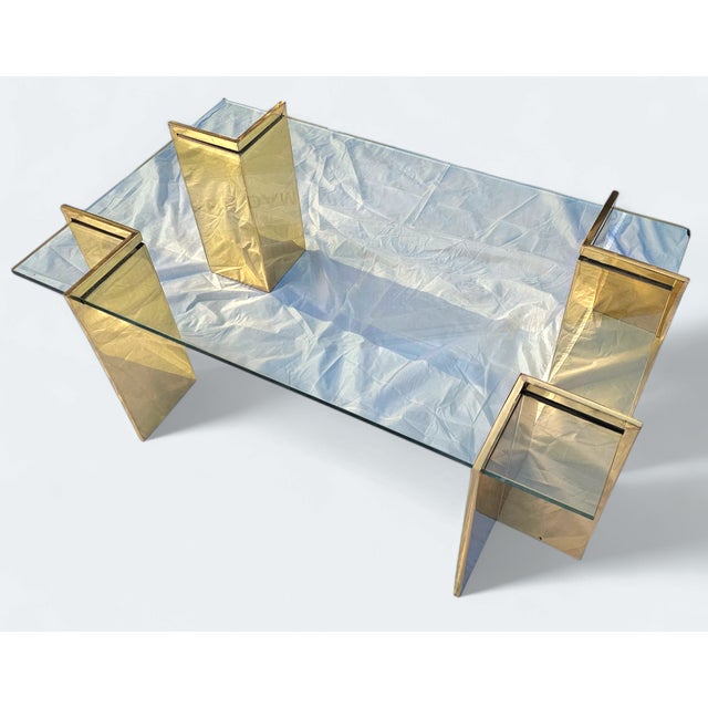 This Vintage Polished Brass and Glass Coffee Table combines geometric form with modern features like glass and sumptuous...