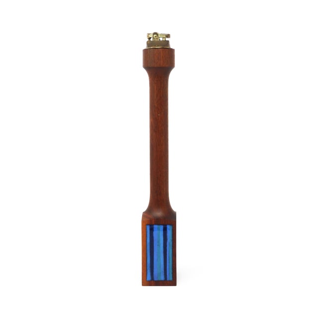 A stunning sculptural mid-century or Scandinavian modern turned teak table lighter with blue enameled accent on the base....