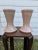 The clean, modern shape of the nude to blush colored vases start with a wide ridged rim at the top narrowing through the...