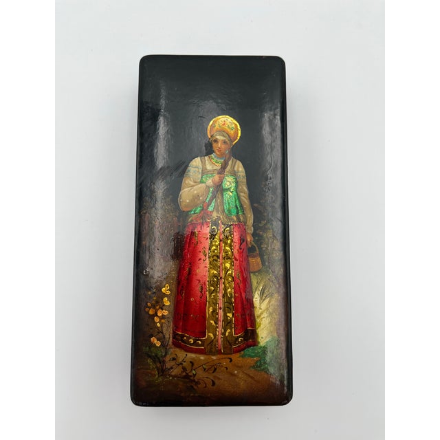 Vintage Russian hand-painted lacquer box. Features woman in Folk dress.
