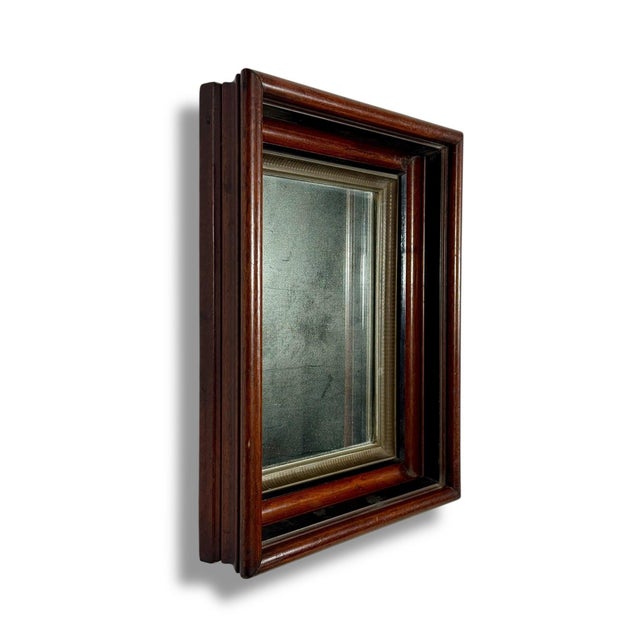 Antique 19th Century Victorian Eastlake Walnut Deep Well Mirror with Gilded Liner Presenting a beautiful piece of American...