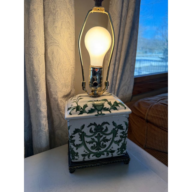 Ceramic lamp base with a green and white acanthus/urn motif, inspired by Italian Renaissance or Neoclassical designs •...