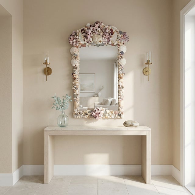 This beautiful sea shell encrusted mirror is a unique and elegant addition to any room. The frame of the mirror is adorned...