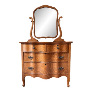 Antique 1900’s Atlas Furniture Co. Tiger Oak Serpentine Dresser With Tilting Beveled Mirror and Bail Pull Handles For Sale