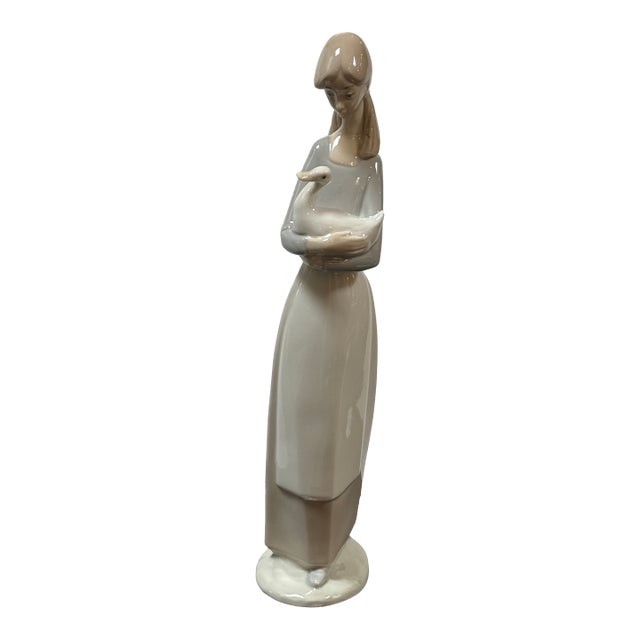 Nao for Lladró Girl in Apron Holding Duck Porcelain Figurine, Signed For Sale