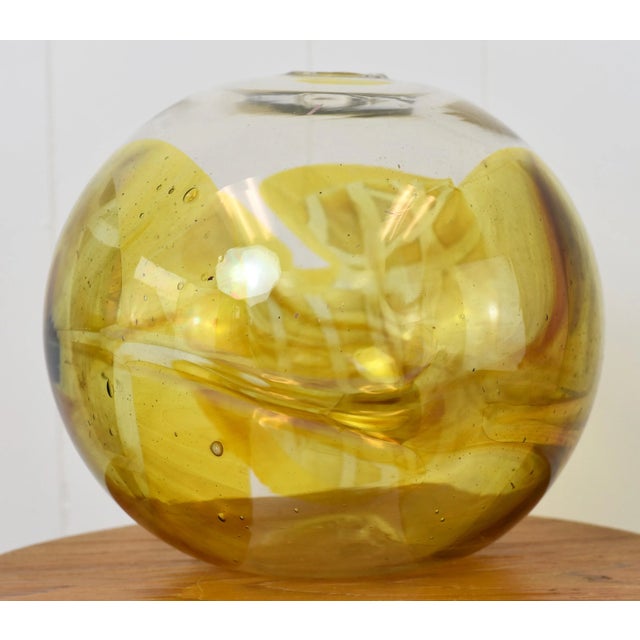 Peter Bramhall blown glass orb sculpture. Signed Bramhall on bottom and dated December 1980. Measurements: Height:...