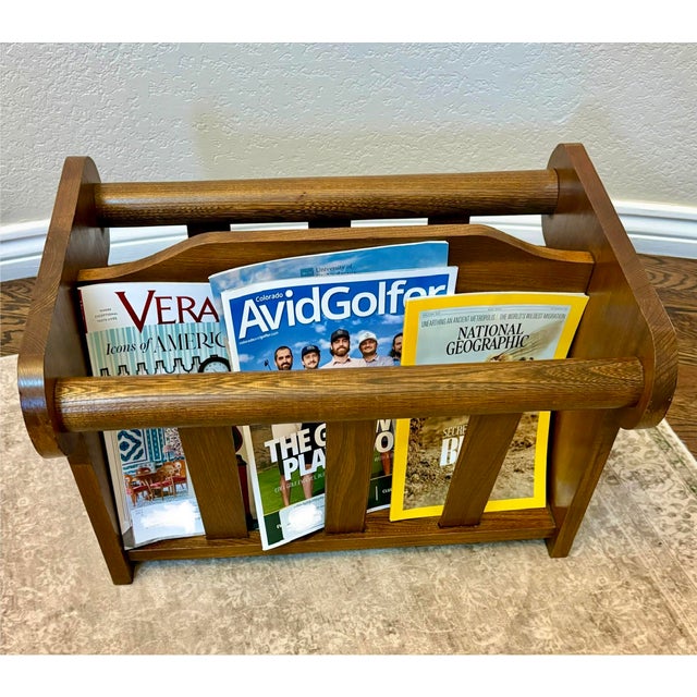A beautifully crafted vintage Furniture by Leick magazine rack, proudly made in Sheboygan, Wisconsin, showcasing the...