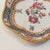 A very fine small Chinese export porcelain bowl. With famille rose decoration, blue underglaze cells, and a scalloped...