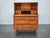 Elegant Danish Modern teak secretary desk dating from the 1960s, combining sophisticated Scandinavian design with...