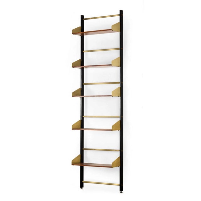 "S2" bookcases by Feal (Fonderie Elettriche Alluminio e Leghe), in black anodized aluminum, contrasting with the brass and...