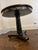 A 19th Century English Regency Chinoiserie Black and Parcel-Gilt Lacquered Center Table, with a pedestal base raised on...