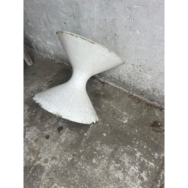 A striking vintage sculptural planter from the 1970s, crafted in cast concrete. Its bold, organic hourglass form makes it...