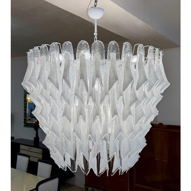A magnificent and highly decorative chandelier produced in Murano, Italy, during the 2000s. This impressive lighting piece...
